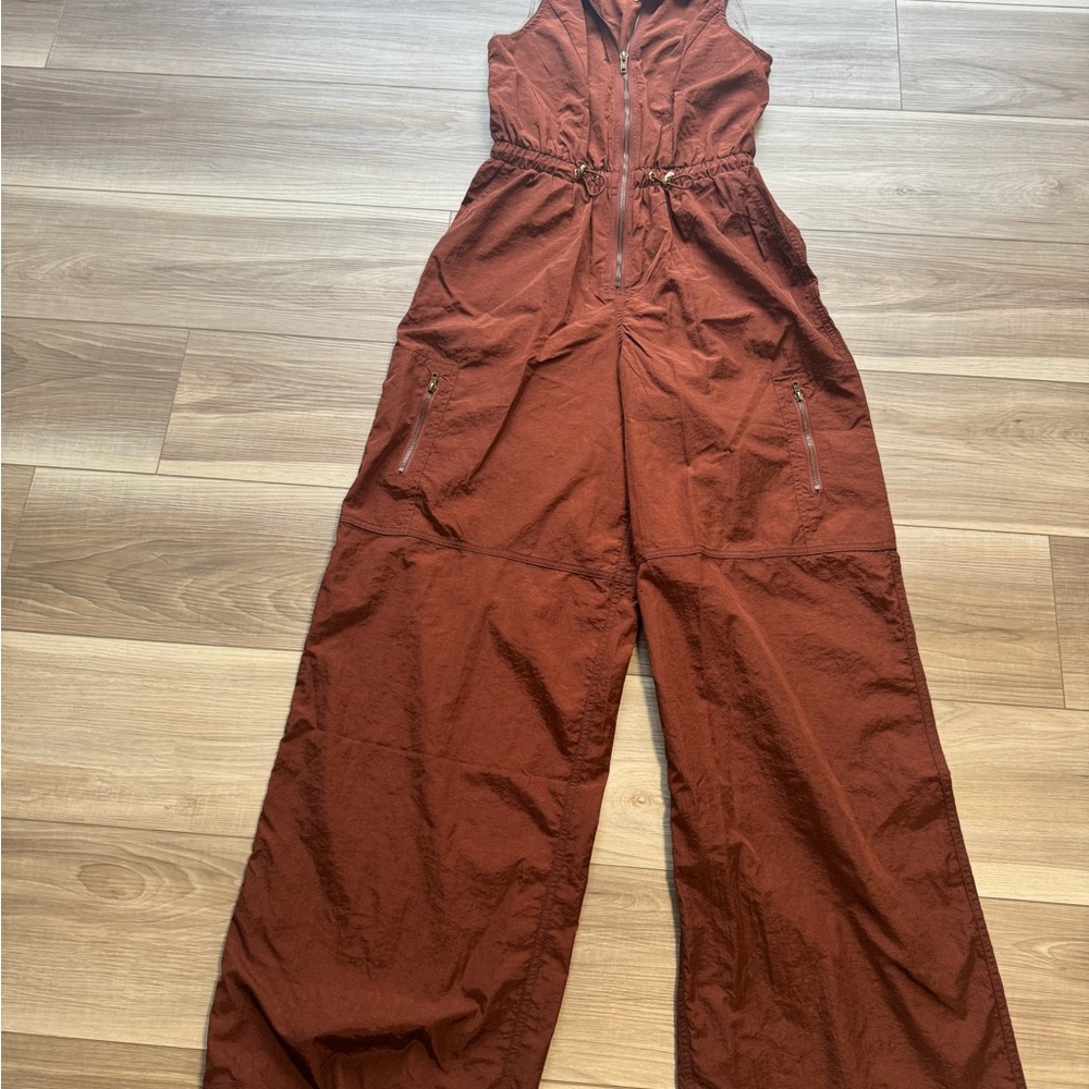 Rust Jumpsuit by Rare London sold at Free People.  Size small.  NWT.